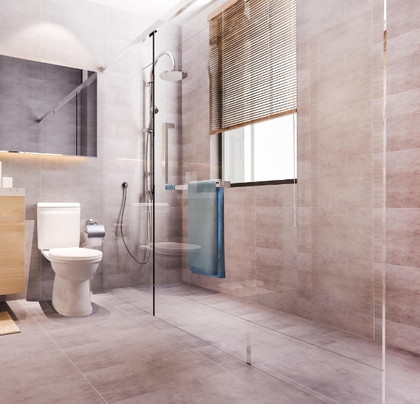 A bathroom featuring a blue tile floor and white cabinets, showcasing flooring services in Fort Walton Beach