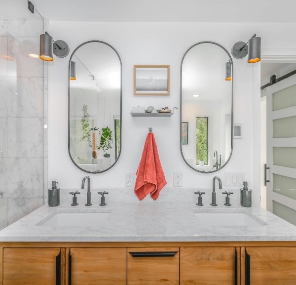 Double vanity with marble countertop and modern fixtures