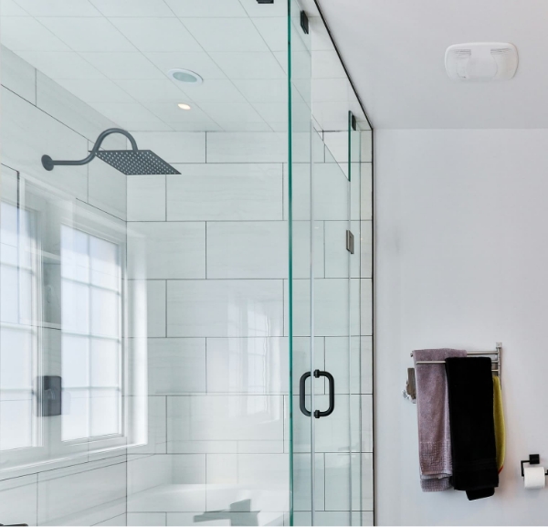 A modern bathroom featuring a glass shower door and a towel rack, highlighting shower remodeling services in Fort Walton Beach