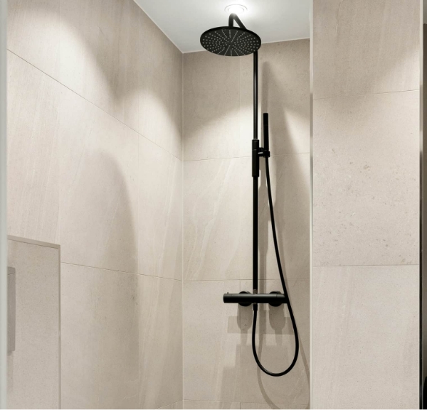 Modern bathroom featuring a sleek shower with a black shower head, highlighting shower remodeling services in Destin